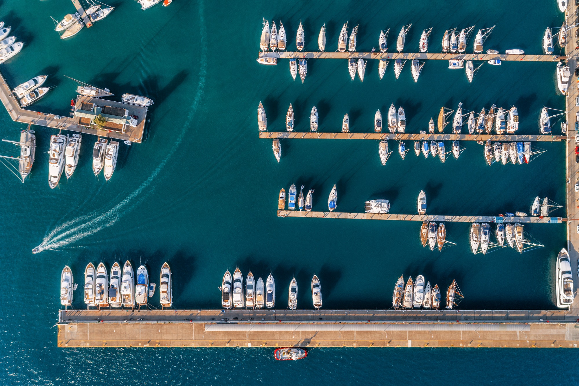 Aerial view of amazing boats at sunset. Minimalistic landscape