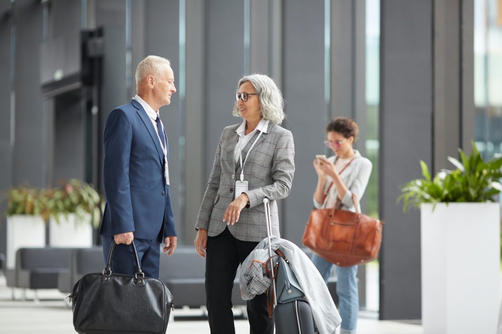 Business forum participants meeting in airport