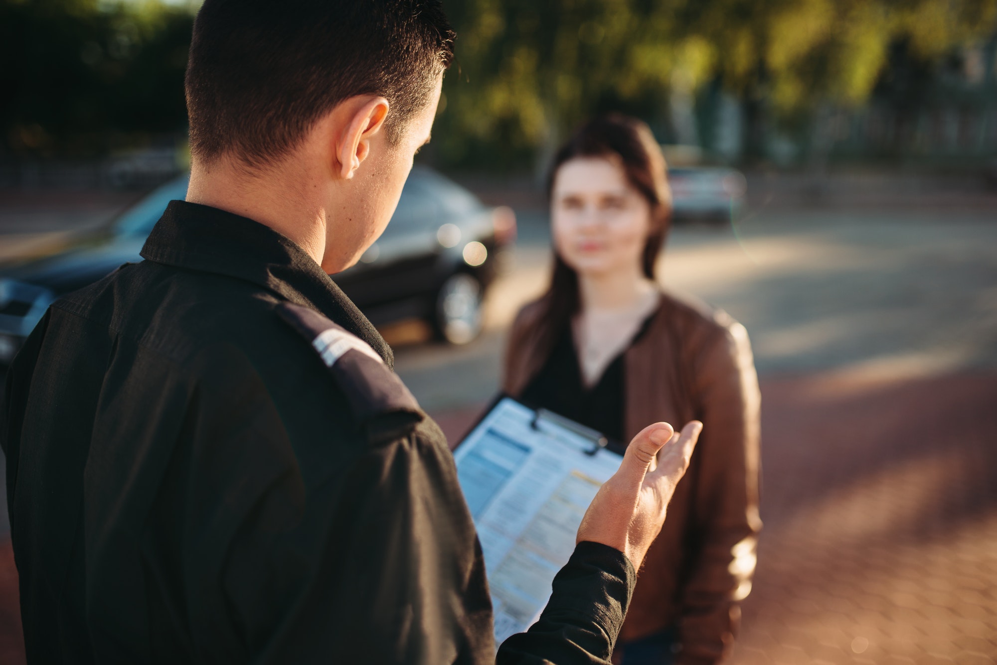 Police officers reads law to female driver