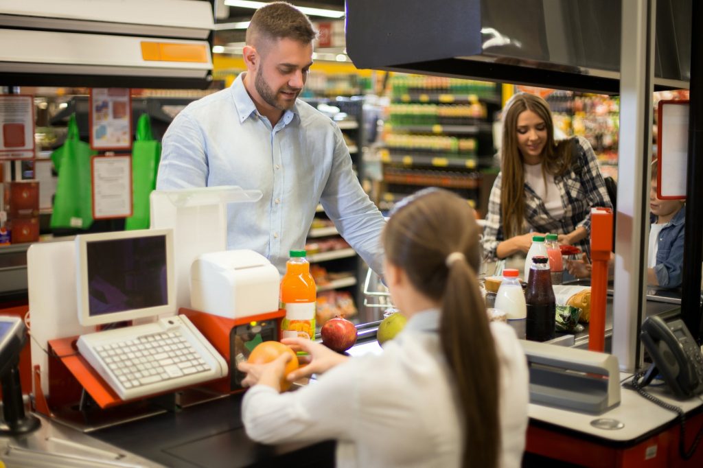 Young Man Buying Groceries